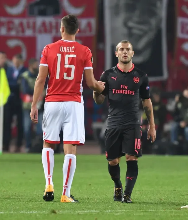 Framed Print : Jack Wilshere and Srdan Babic Exchange Handshakes: Crvena Zvezda vs. Arsenal FC, UEFA Europa League 2017-18