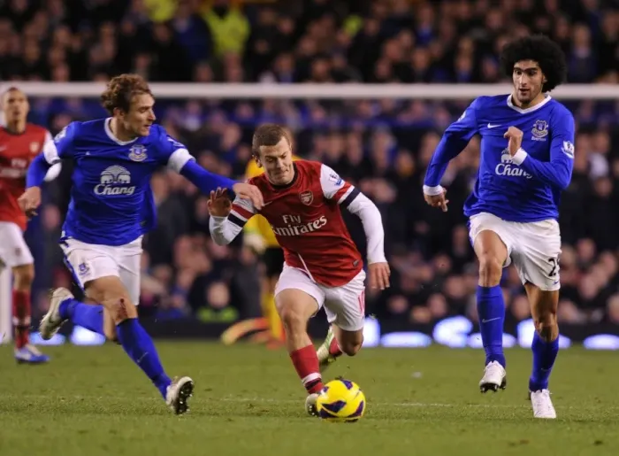 Framed Print : Jack Wilshere Surges Past Nikica Jelavic and Marouane Fellaini in Everton vs Arsenal Premier League Clash Framed Print : Jack Wilshere Surges Past Nikica Jelavic and Marouane Fellaini in Everton vs Arsenal Premier League Clash