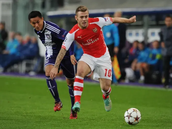 Framed Print : Jack Wilshere vs. Andy Najar: Clash in the UEFA Champions League