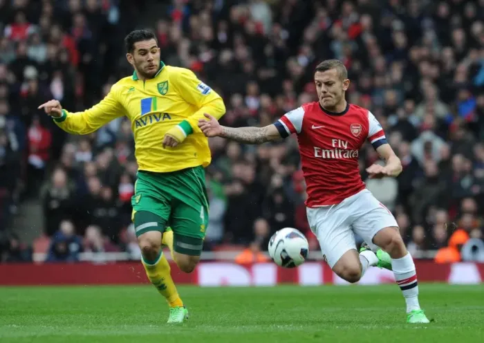 Framed Print : Jack Wilshere vs Bradley Johnson: Intense Battle at Arsenal v Norwich City, Premier League 2012-13