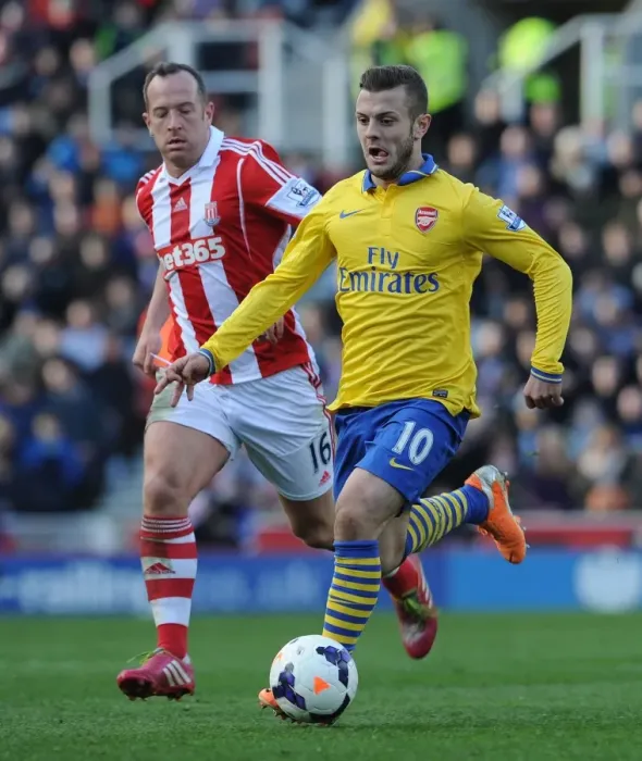 Framed Print : Jack Wilshere vs. Charlie Adam: Midfield Showdown in Arsenal vs. Stoke City Premier League Clash (2013-14)
