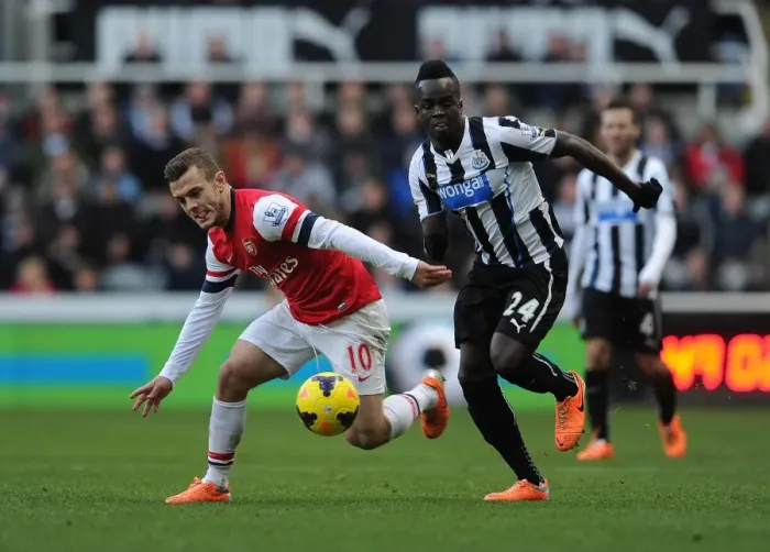 Framed Print : Jack Wilshere vs. Cheick Tiote: Battle in the Midfield - Newcastle United vs. Arsenal (2013-14) Framed Print : Jack Wilshere vs. Cheick Tiote: Battle in the Midfield - Newcastle United vs. Arsenal (2013-14)