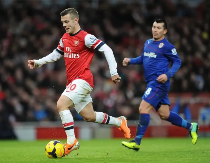 Framed Print : Jack Wilshere vs. Gary Medel: Intense Battle in Arsenal v Cardiff City Premier League Clash