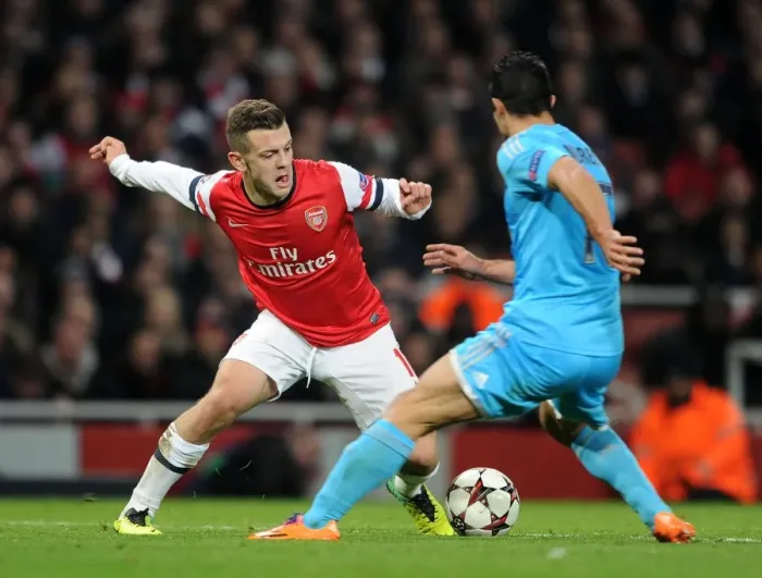 Framed Print : Jack Wilshere vs. Jeremy Morel: Battle in the Midfield - Arsenal v Marseille, UEFA Champions League, 2013