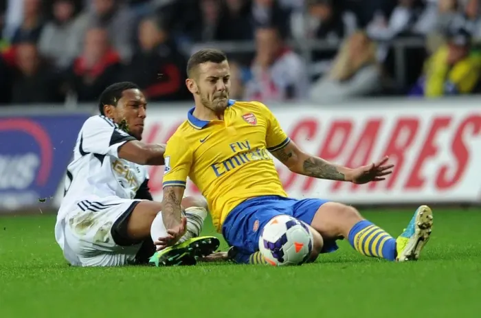 Framed Print : Jack Wilshere vs. Jonathan De Guzman: Intense Tackle in Swansea City vs. Arsenal Premier League Clash Framed Print : Jack Wilshere vs. Jonathan De Guzman: Intense Tackle in Swansea City vs. Arsenal Premier League Clash