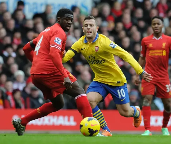 Framed Print : Jack Wilshere vs. Kolo Toure: Intense Rivalry at Anfield (Liverpool v Arsenal, 2013-14) Framed Print : Jack Wilshere vs. Kolo Toure: Intense Rivalry at Anfield (Liverpool v Arsenal, 2013-14)