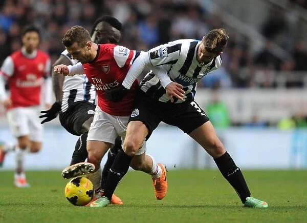 Jack Wilshere vs. Mathieu Debuchy: Intense Rivalry in Newcastle United vs. Arsenal Football Clash (2013-14)