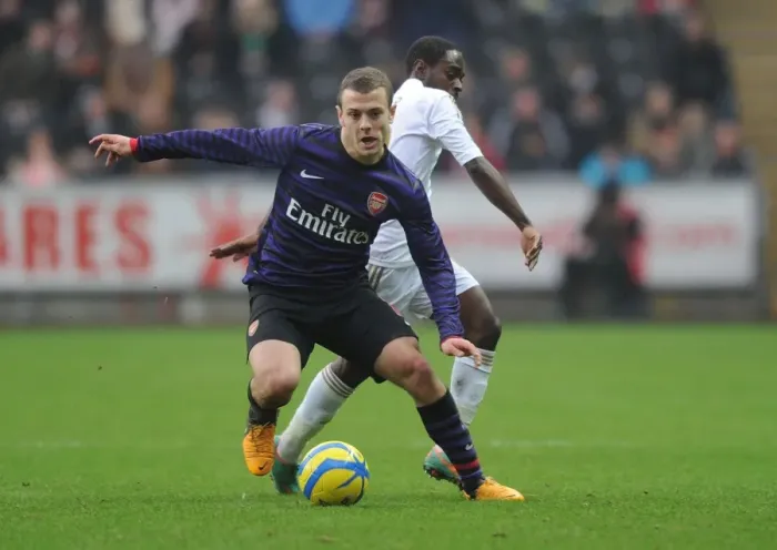 Framed Print : Jack Wilshere vs. Nathan Dyer: Battle in the FA Cup Third Round between Swansea and Arsenal Framed Print : Jack Wilshere vs. Nathan Dyer: Battle in the FA Cup Third Round between Swansea and Arsenal