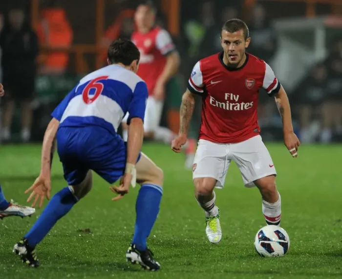 Framed Print : Jack Wilshere vs. Niall Keown: Clash of Young Talents in Arsenal U21 vs. Reading U21 (2012-13)