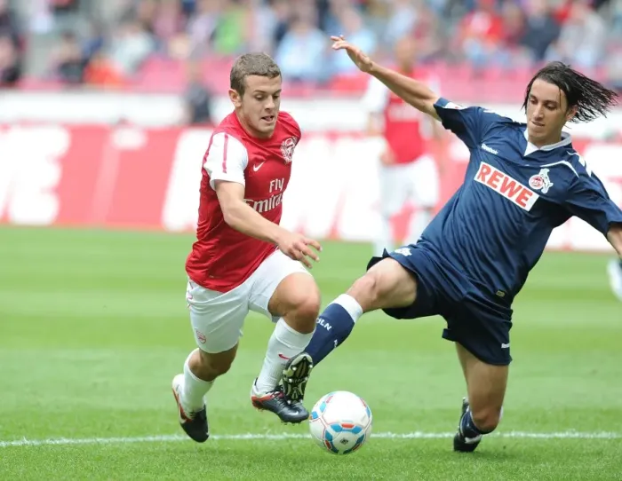 Framed Print : Jack Wilshere vs Pedro Geromel: Clash in Pre-Season Friendly between Cologne and Arsenal