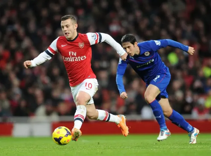 Framed Print : Jack Wilshere vs. Peter Whittingham: Intense Battle at Arsenal vs. Cardiff City (2013-14) Framed Print : Jack Wilshere vs. Peter Whittingham: Intense Battle at Arsenal vs. Cardiff City (2013-14)