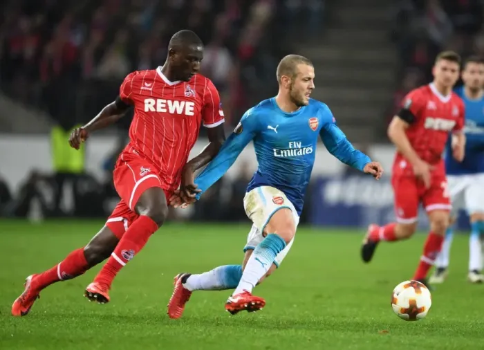 Framed Print : Jack Wilshere vs. Sehrou Guirassy: Battle in the Europa League between Arsenal and 1. FC Koln