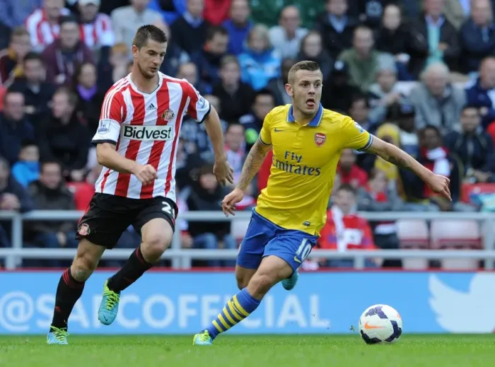 Framed Print : Jack Wilshere vs Valentin Roberge: Intense Clash in Sunderland v Arsenal (Premier League 2013-14)
