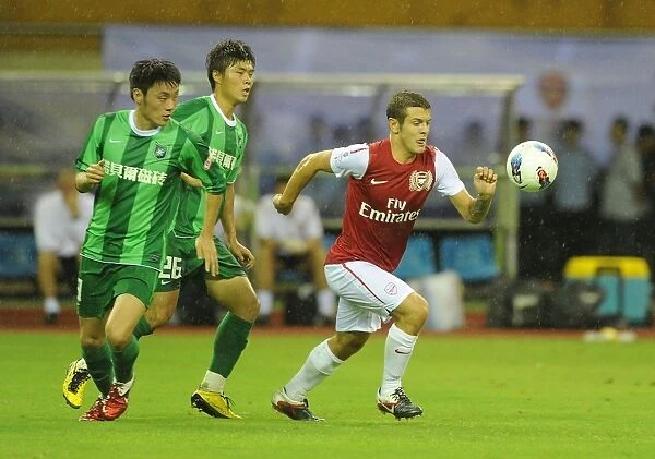 Jack Wilshere vs. Yang Chen and Wang Quan: Hangzhou Greentown vs. Arsenal, China, 2011