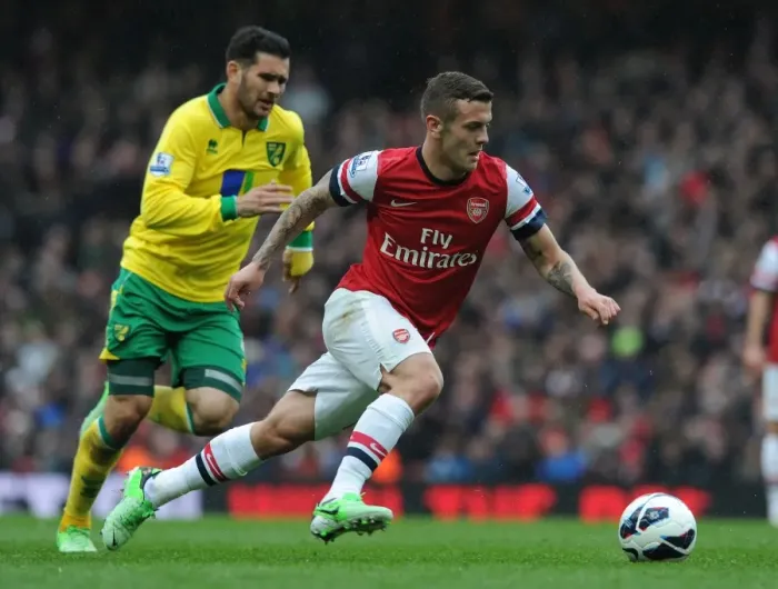 Framed Print : Jack Wilshere's Agile Moves: Outmaneuvering Norwich's Bradley Johnson in the 2012-13 Arsenal Victory