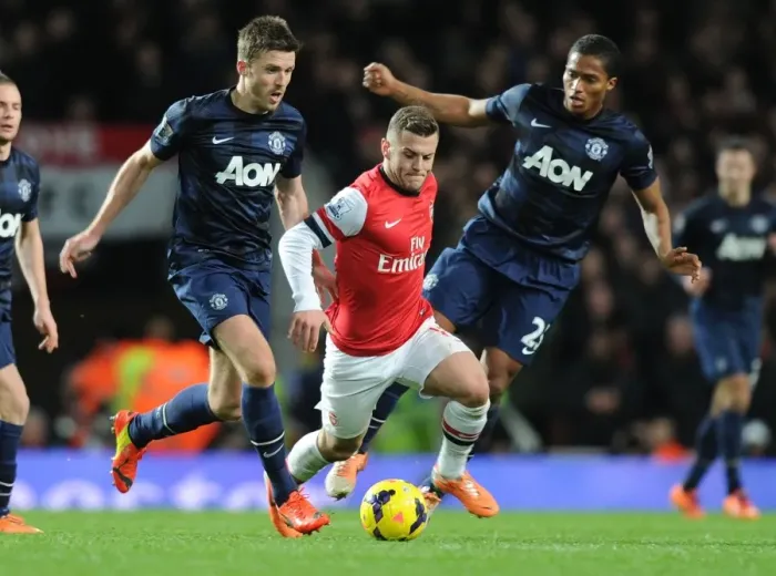 Framed Print : Jack Wilshere's Agile Outmaneuver: Arsenal Star Outwits Michael Carrick and Antonio Valencia (2013-14) Framed Print : Jack Wilshere's Agile Outmaneuver: Arsenal Star Outwits Michael Carrick and Antonio Valencia (2013-14)