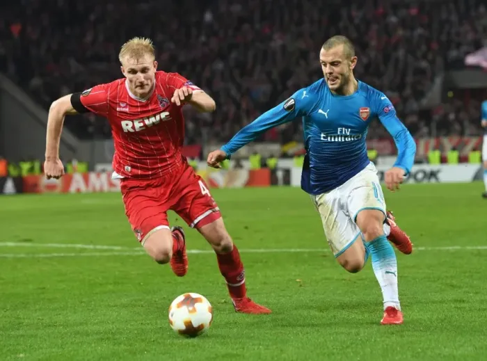Framed Print : Jack Wilshere's Agile Outmaneuver of Fredrik Sorensen: A Thrilling Moment from Arsenal's Europa League Battle against FC Koln
