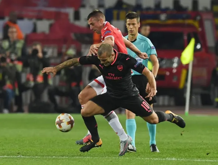 Framed Print : Jack Wilshere's Dominance: Overpowering Nenad Krsticic in the Europa League Clash between Arsenal and Crvena Zvezda