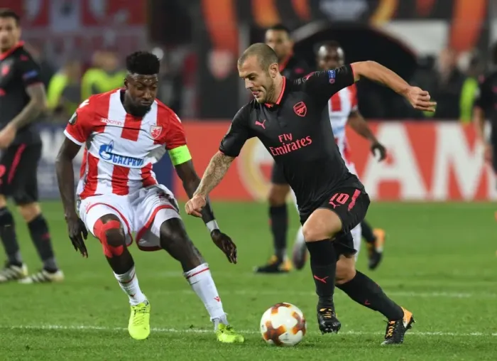 Framed Print : Jack Wilshere's Powerful Past: Overpowering Mitchell Donald in Arsenal's Europa League Triumph