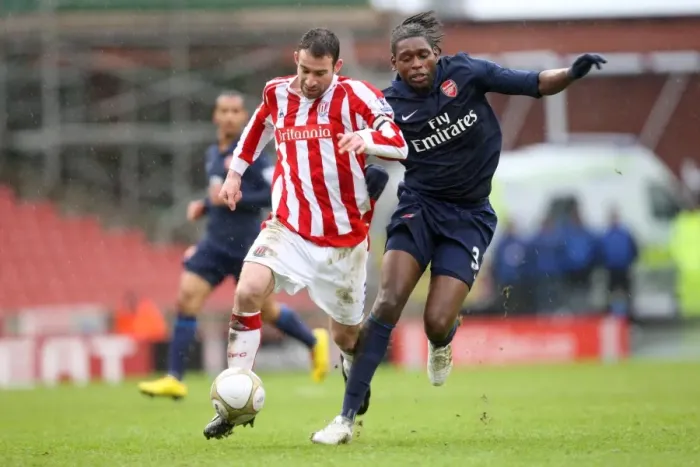 Framed Print : Jay Emmanuel-Thomas (Arsenal) Danny Higginbotham (Stoke). Stoke City 3: 1 Arsenal