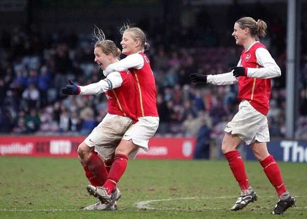 Jayne Ludlow celebrates scoring Arsenals goal with Katie Chapman and Kelly Smith