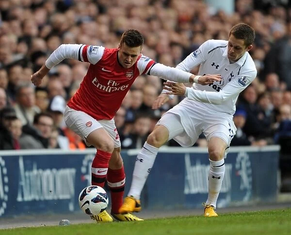 Jenkinson Fouls Sigurdsson: Intense Rivalry in Tottenham Hotspur vs Arsenal Premier League Clash