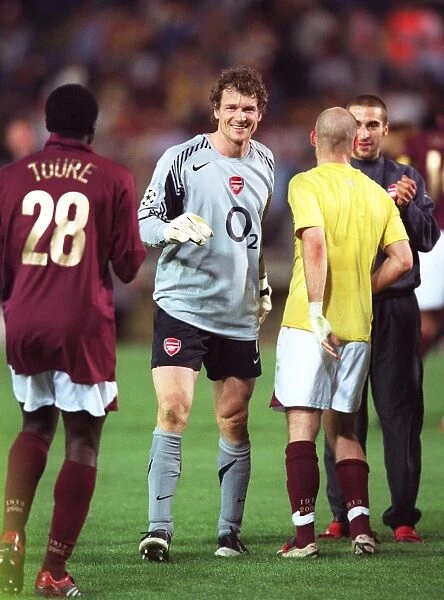 Jens Lehmann (Arsenal) celebrates at the end of the match with Kolo Toure