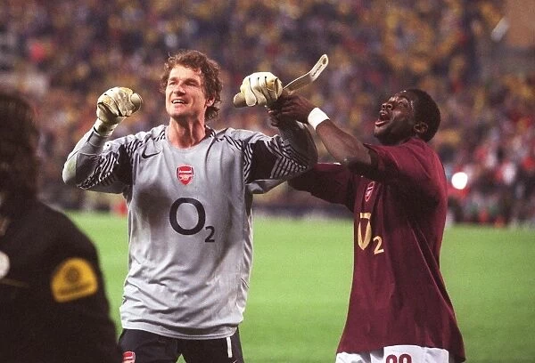 Jens Lehmann and Kolo Toure (Arsenal) celebrate their draw that puts them into the final