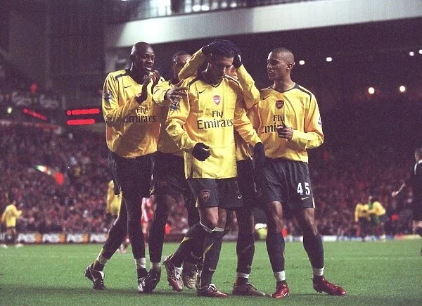 Jeremie Aliadiere is congratulated by Abou Diaby and Armand Traore for setting up Julio Baptista for Arsenals 6th goal. Liverpool 3:6 Arsenal. Catling Cup 5th Round. Anfield, Liverpool, 9 / 1 / 07. Credit: Arsenal Football Club  / 