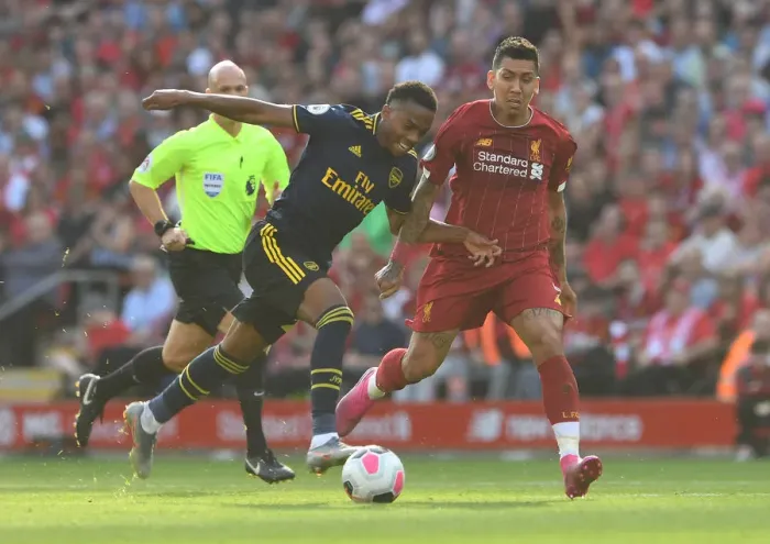 Framed Print : Joe Willock vs. Roberto Firmino: Intense Battle at Anfield - Liverpool vs. Arsenal, Premier League 2019-2020