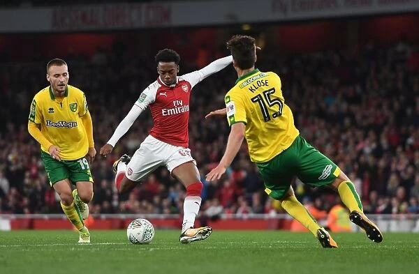 Joe Willock vs. Timm Klose: Tense Moment in the Carabao Cup Fourth Round Clash Between Arsenal and Norwich City