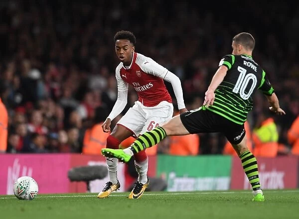 Joe Willock vs. Tommy Rowe: Intense Battle in Arsenal's Carabao Cup Clash Against Doncaster