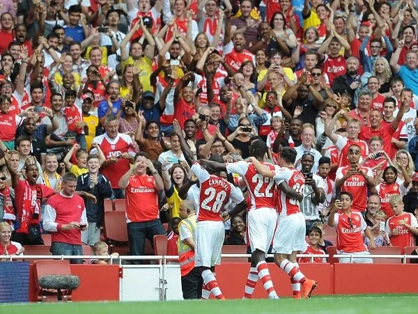 Joel Campbell celebrates scoring Arsenals 2nd goal with the fans. Arsenal 5: 1 Benfica