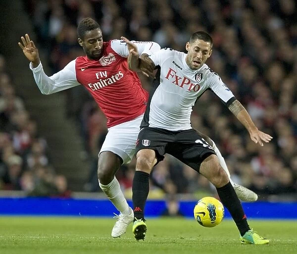 Johan Djourou of Arsenal takes on Clint Dempsey of Fulham during the Barclays Premier League match between Arsenal and Fulham at Emirates Stadium on November 26, 2011 in London, England. Credit; Arsenal