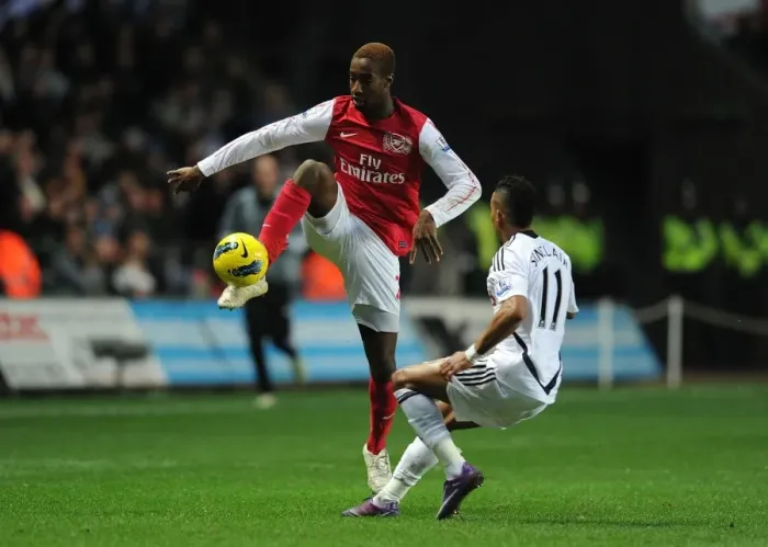 Framed Print : Johan Djourou vs. Scott Sinclair: A Battle in the Premier League Between Swansea City and Arsenal