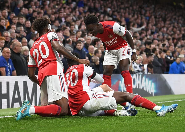 Jubilant Moment: Smith Rowe and Saka Celebrate Arsenal's Victory over Chelsea, Premier League 2021-22