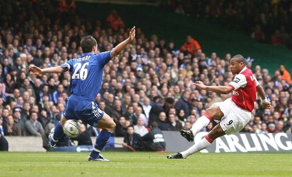 Julio Baptista (Arsenal) shoots past Chelsea defender John Terry but hac