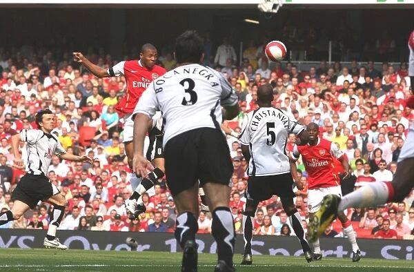 Julio Baptista heads over Philippe Christanval to score the 1st Arsenal goal