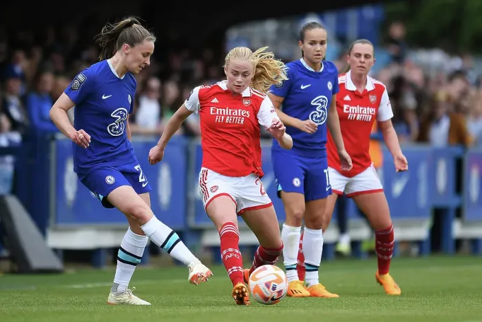 Framed Print : Kathrine Kuhl vs. Niamh Charles: Intense Battle in Chelsea Women vs. Arsenal Women's Super League Match
