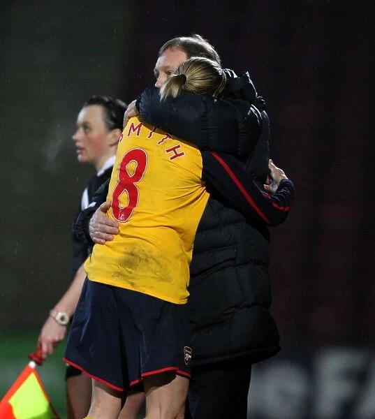 Kelly Smith (Arsenal) hugs manager Vic Akers after being subbed in her