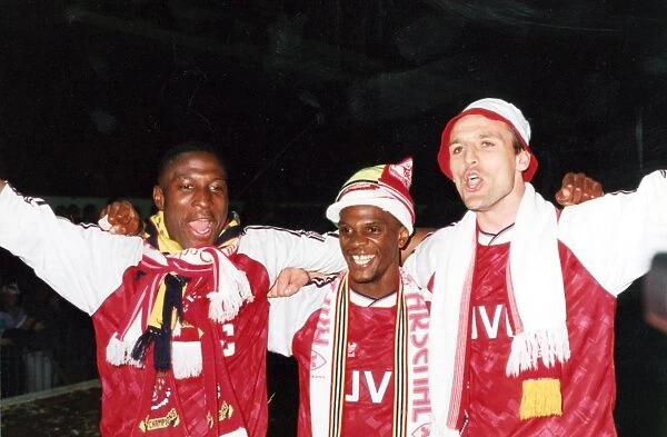 Kevin Campbell, Paul Davis and Steve Bould celebrate winning the League Championship