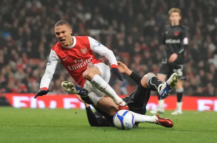 Framed Print : Kieran Gibbs is tripped for the Arsenla penalty buy Orients Alex Revell