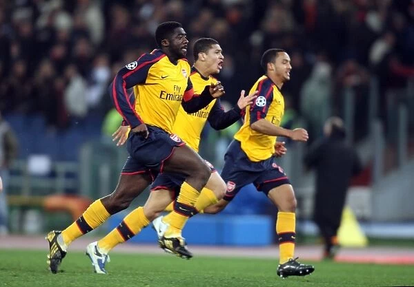 Kolo Toure, Denilson and Theo Walcott celebrate Arsenal winning the penalty shoot out
