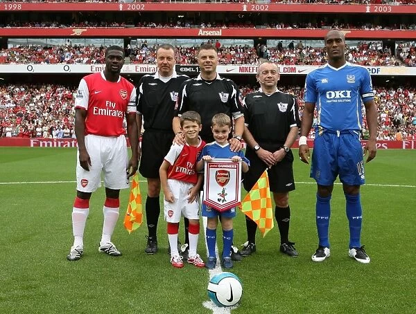 Kolo Toure (Arsenal) Sylvian Distan (Manchester City) with officials