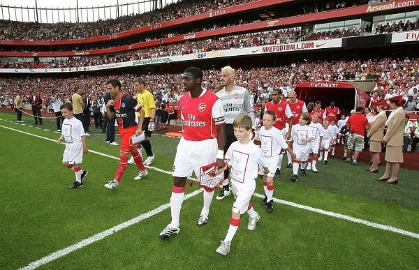 Kolo Toure (Arsenal) leads out the team