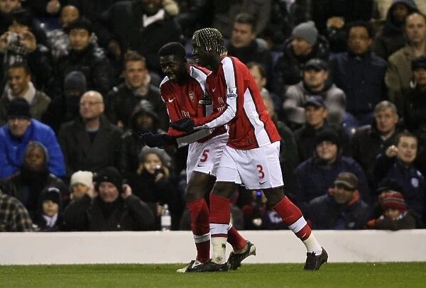 Kolo Toure celebrates scoring the 2nd Arsenal goal with Bacary Sagna