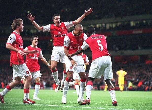 Kolo Toure celebrates scoring Arsenals 2nd goal with Thierry Henry