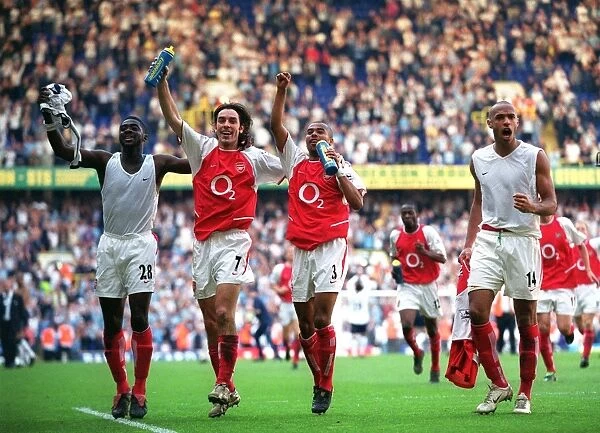 Kolo Toure, Robert Pires, Ashley Cole and Thierry Henry (Arsenal) celebrate at the end of the match