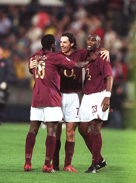 Kolo Toure, Robert Pires and Sol Campbell (Arsenal) celebrate at the end of the match