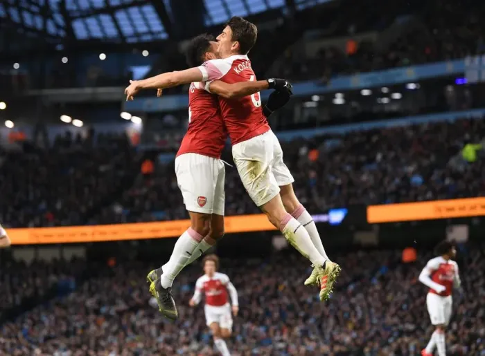 Framed Print : Koscielny and Aubameyang Celebrate Arsenal's Goal Against Manchester City (2018-19)